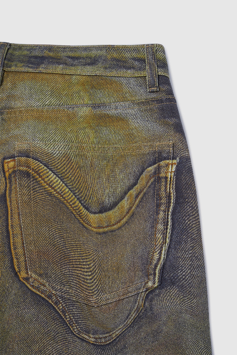 Denimbroek met wijde pijpen en abstract patroon in aardetinten